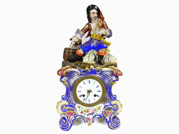 A Painted Porcelain Figural Table Clock