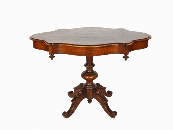 An Oval Walnut Table