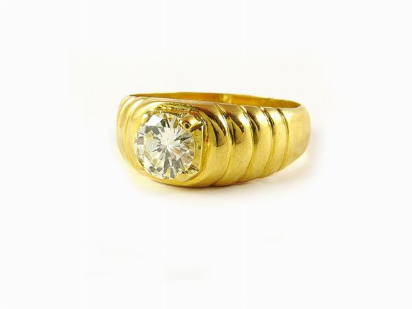 Anello a fascia fesonata in oro giallo e diamante
