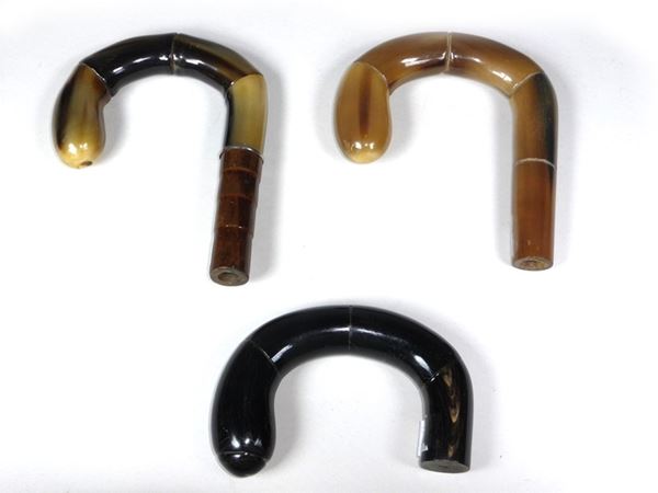 Three horn handles for sticks