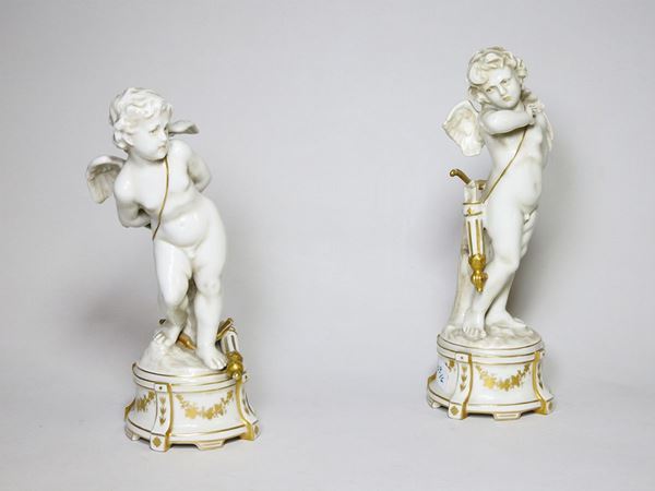 Pair of Porcelain Figures of Cupid
