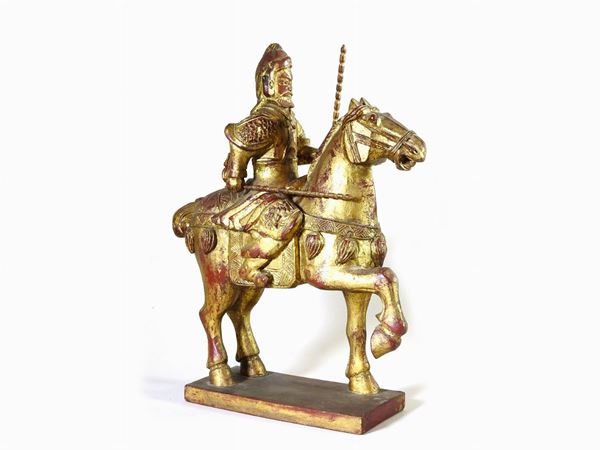 Lacquered and Gilded Wooden Figure of a Warrior on Horseback