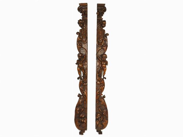 Pair of Carved Walnut Ornaments