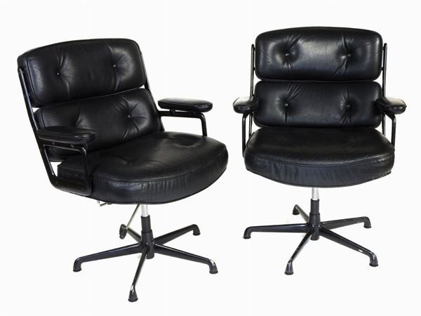 Two Black Leather Swivel Armchairs