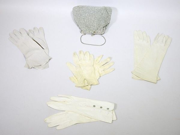 Four leather gloves and a fabric bag