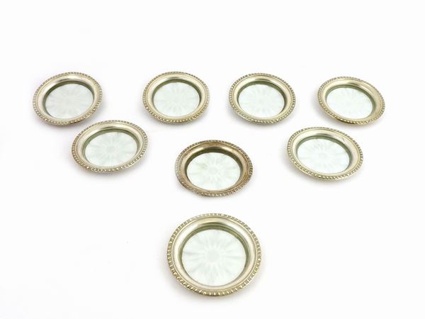 A Set of Eight Crystal and Silver Glass Coasters