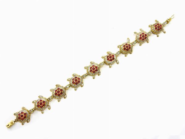 Yellow gold, rubies and diamonds animalier-shaped bracelet