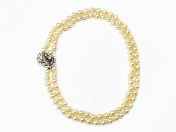Two strands cultured pearls necklace with white gold and diamonds clasp