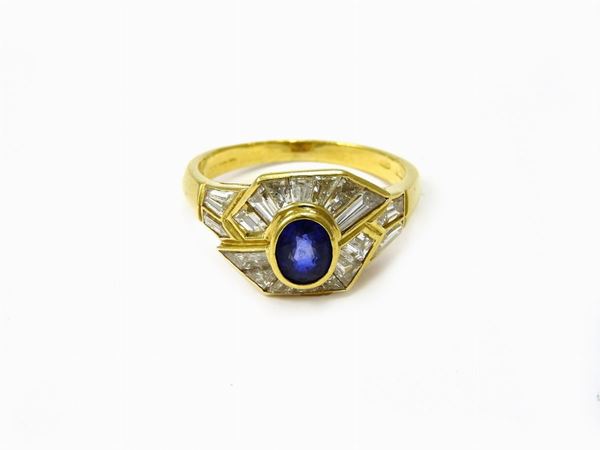 Yellow gold ring with diamonds and sapphire