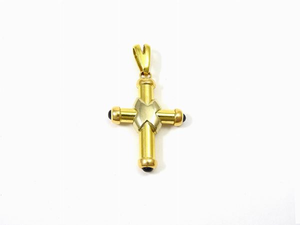 White and yellow gold cross shaped pendant with sapphires