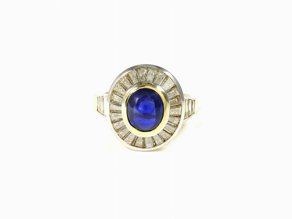 Yellow and white gold ring with diamonds and sapphire
