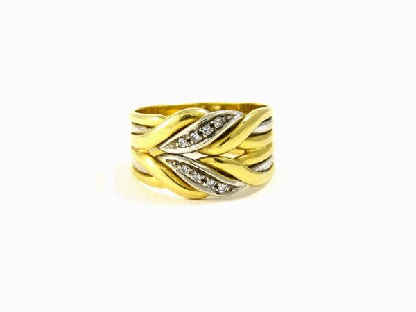 White and yellow gold braided ring with diamonds