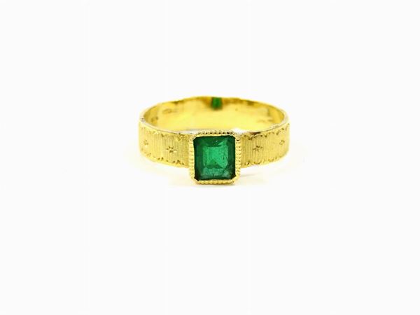 Yellow satin gold ring with emerald