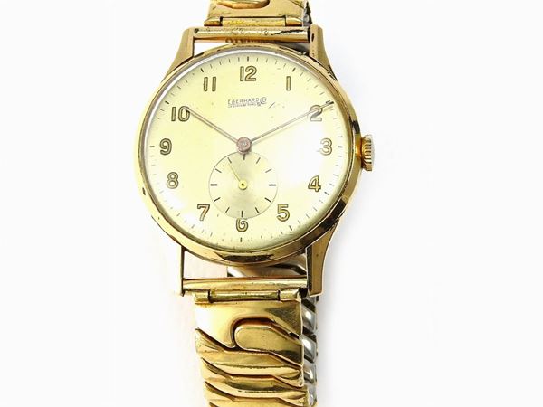 Manual yellow gold and steel gentlemans wristwatch