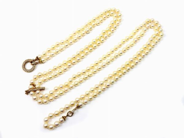 Long two strands Akoya pearls necklace  with yellow gold divisible clasp set with diamonds
