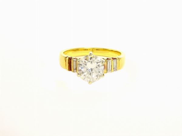 Yellow gold solitaire with diamonds