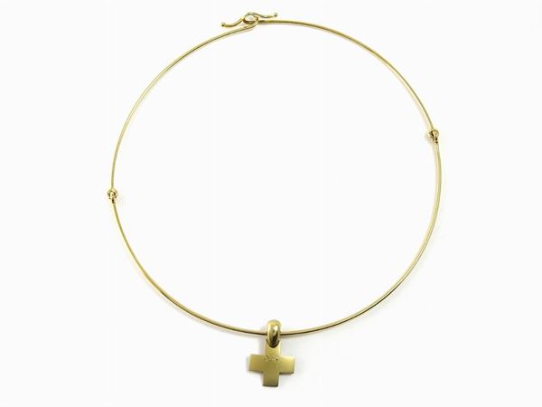 Gold semi-rigid collar with square cross shaped pendant