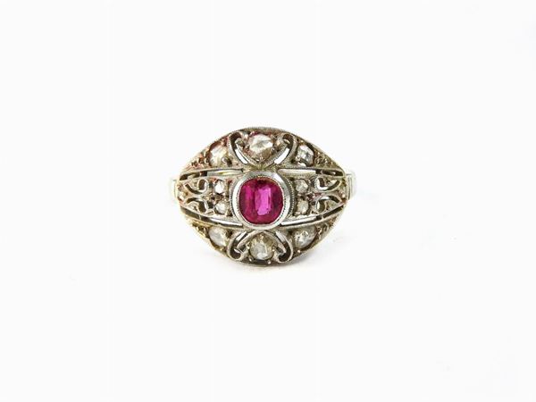 White gold ring with diamonds and ruby
