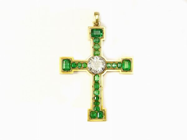 Yellow gold, diamond and emeralds pendant realized as a cross