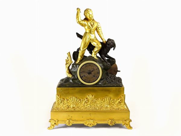 Orologio da camino in bronzo dorato e patinato