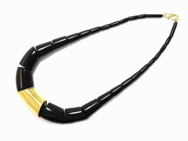 Yellow gold and black coral necklace