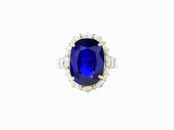 Platinum ring with brilliant cut diamonds and oval cut sapphire