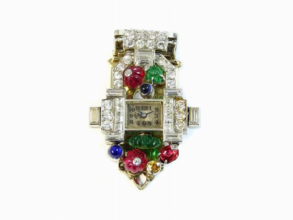 Gold and platinum brooch/watch tutti frutti set with diamonds, rubies, sapphires and emeralds