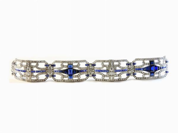 Platinum wrought panels bracelet set with diamonds and sapphires
