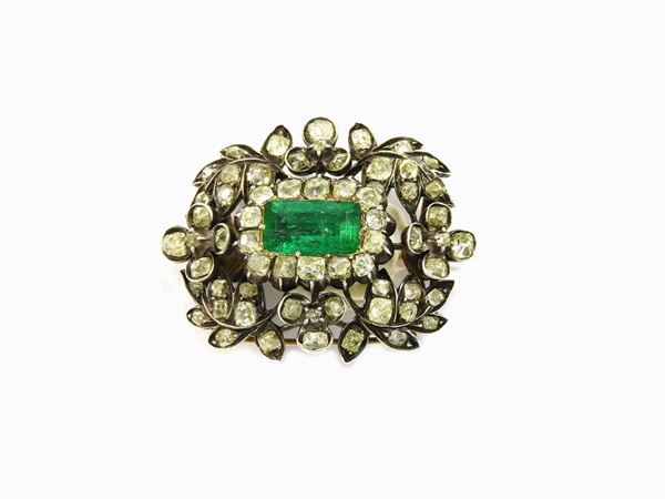 Yellow gold and silver brooch with old cut diamonds and octagonal step cut emerald