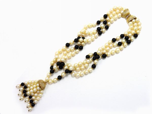 Three strands Akoya pearls and onyx boules necklace