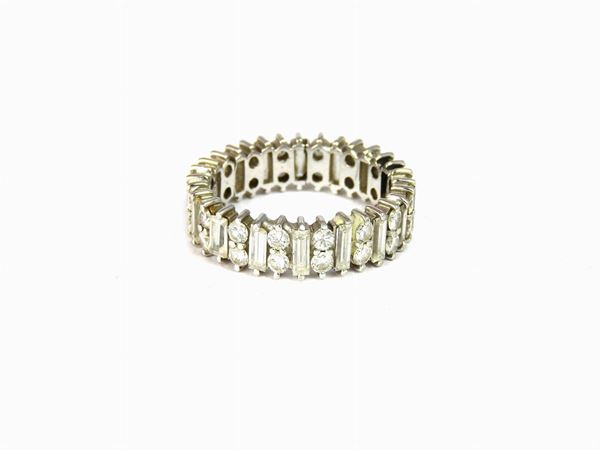 White gold eternity ring with brilliant and baguette cut diamonds