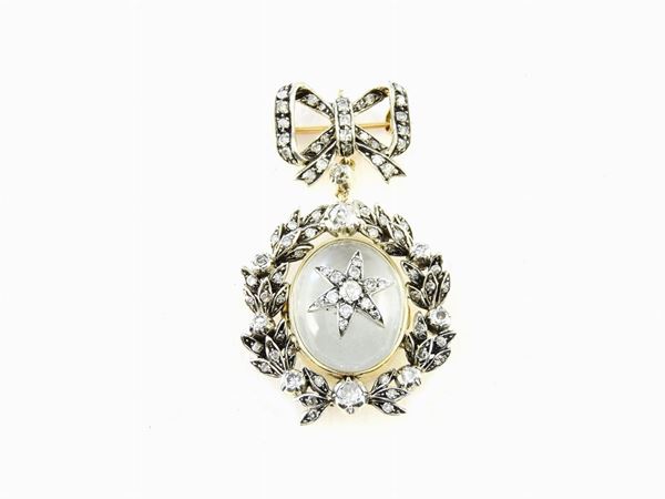 Yellow and white gold locket with diamonds and rock crystal