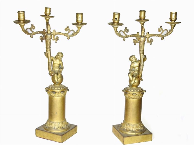 Coppia di Candelabri in Gelamina Dorata