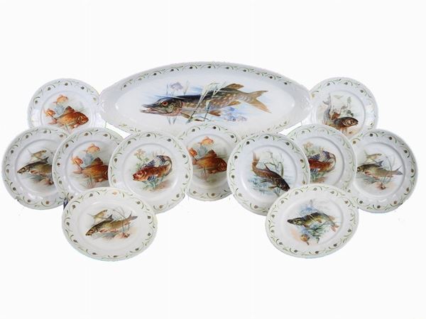 A Set of Eleven Painted Porcelain Plates