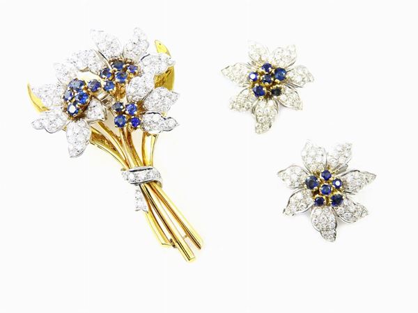 Parure of white and yellow gold brooch and earrings set with diamonds and sapphires