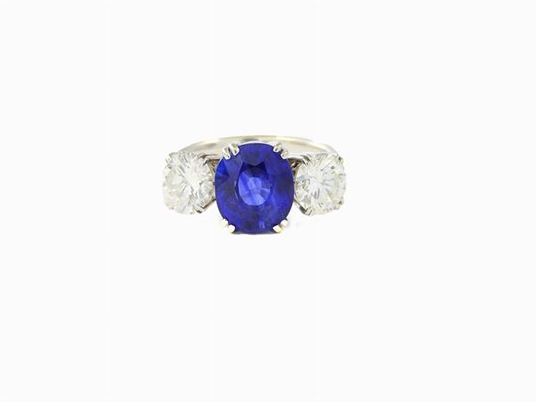 White gold ring with diamonds and sapphire