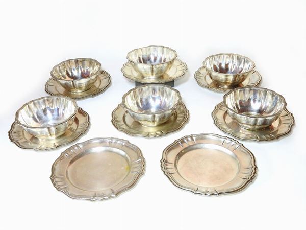 A Set of Six Silver Bowls with Coasters