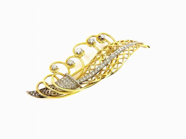 Four white and yellow gold brooches with diamonds