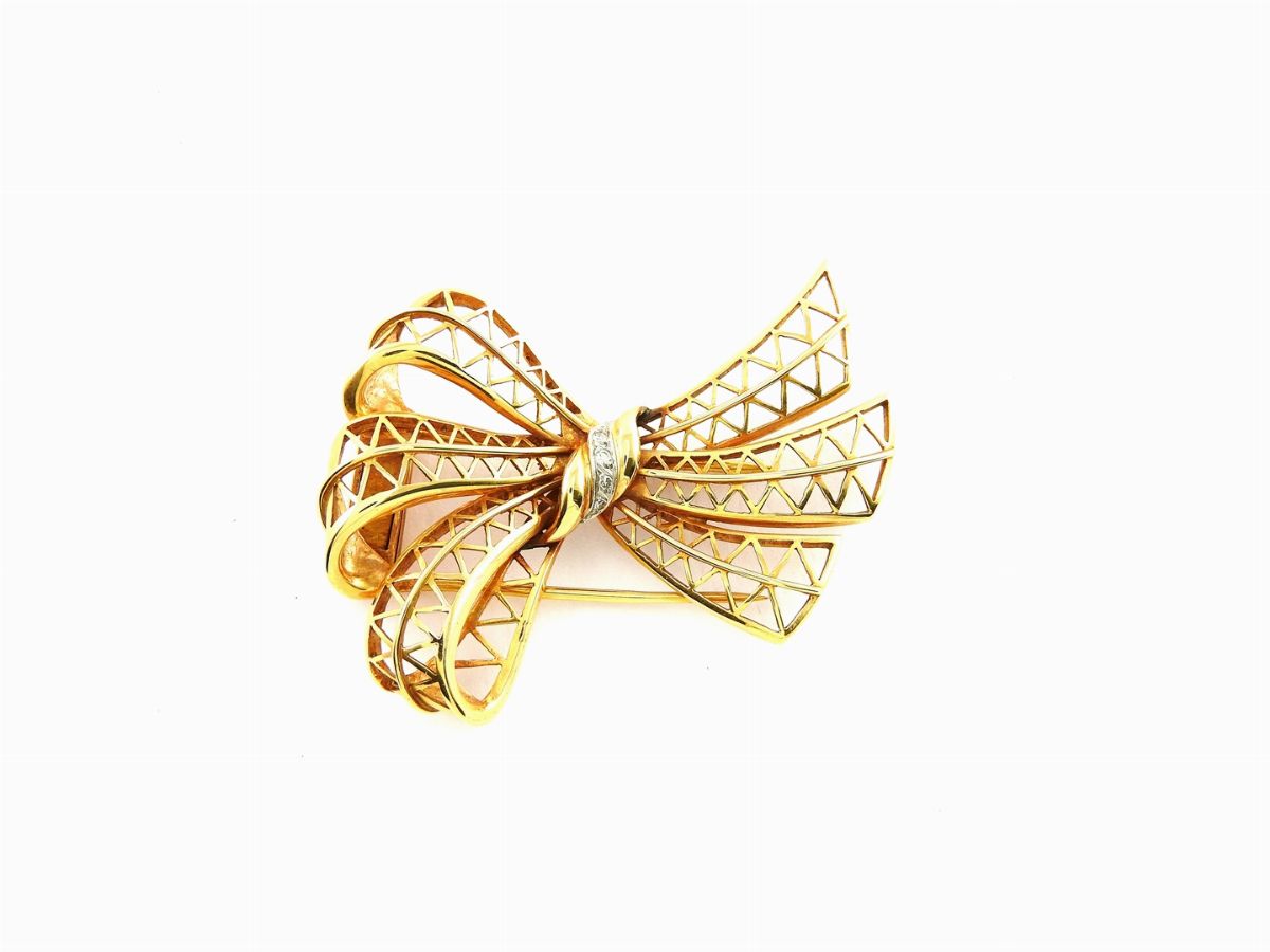 Quattro Spille in Oro Giallo e Bianco con Diamanti