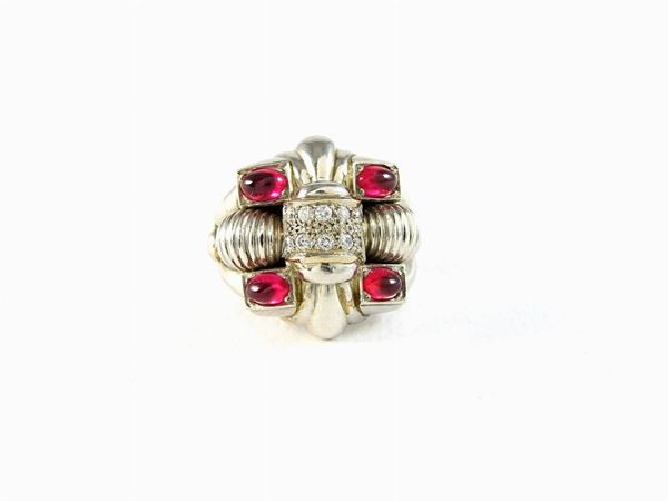 Platinum ring with diamonds and red glasses