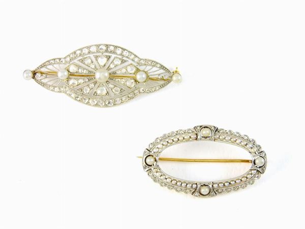 Two white and yellow gold brooches with diamonds and pearls
