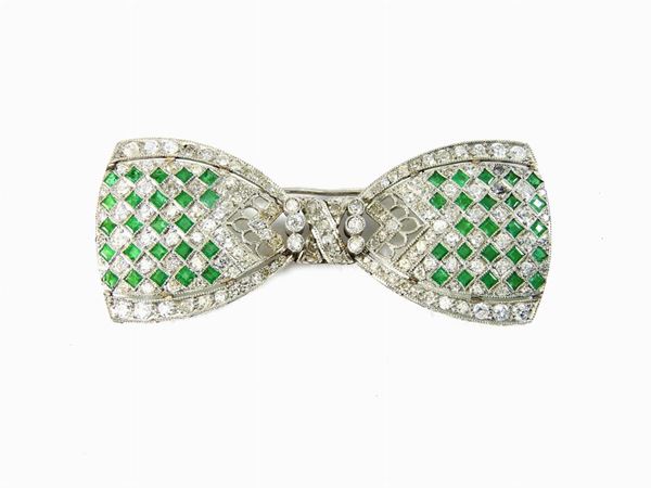 White gold brooch with diamonds and emeralds