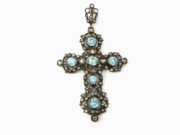 Low alloyed gold and silver pendant with diamonds and light blue zircons
