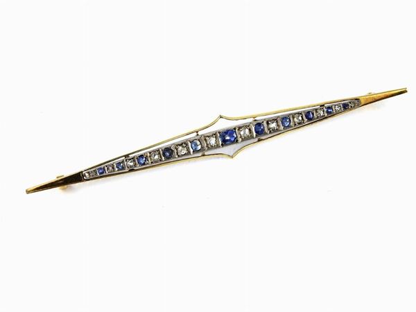 Yellow gold and silver bar brooch with diamonds and sapphires