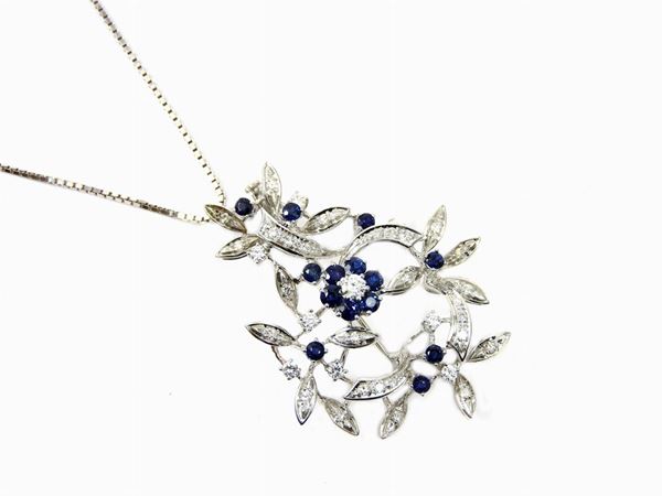 White gold small chain and pendant set with diamonds and sapphires