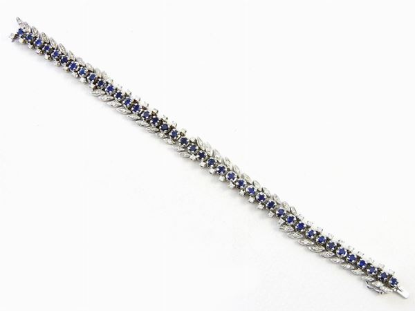 White gold woven bracelet with diamonds and sapphires