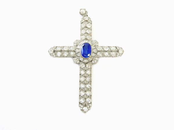 Platinum cross-shaped pendant with diamonds and sapphire