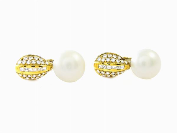 Yellow gold ear pendants with diamonds and button shaped Akoya pearl