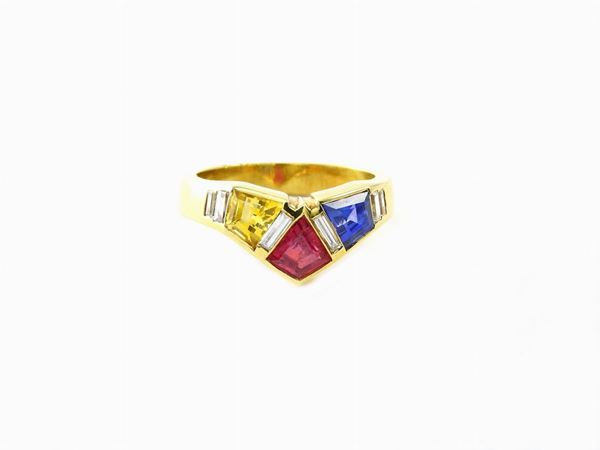 Yellow gold ring with diamonds, ruby, sapphire and yellow sapphire