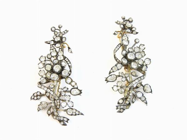 Pair of yellow gold, silver and diamonds brooches